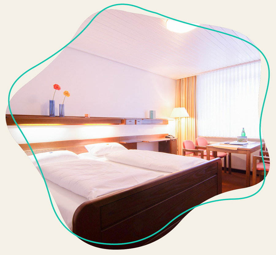 Das Bett ist zu von einem Zimmer beim WDL Dünenhof